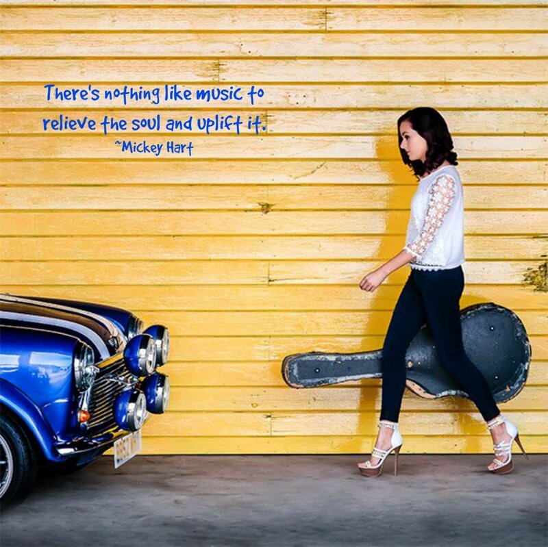 Woman with Guitar Case — Yellow