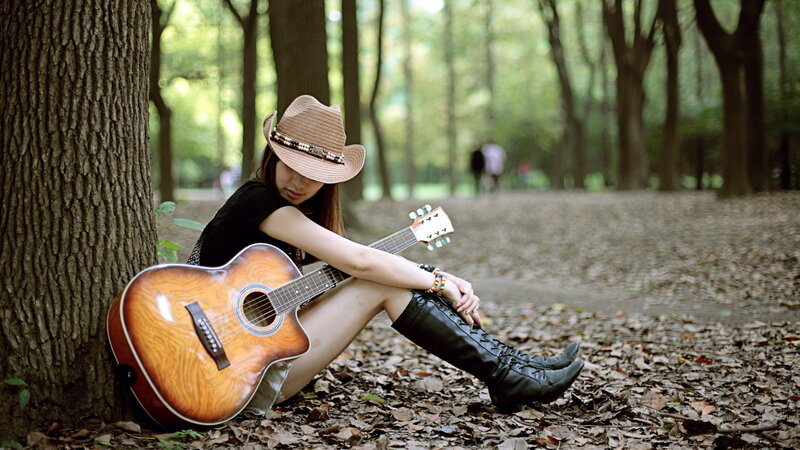 Woman with Guitar in Forest — Brown