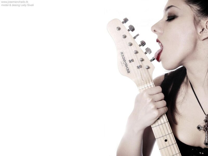 woman with guitar in mouth