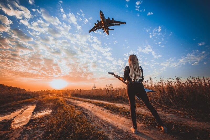 Woman with Guitar on Dirt Road