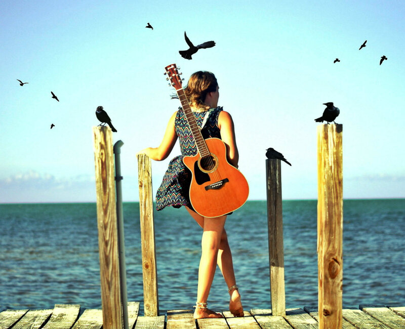 Woman with Guitar on Dock
