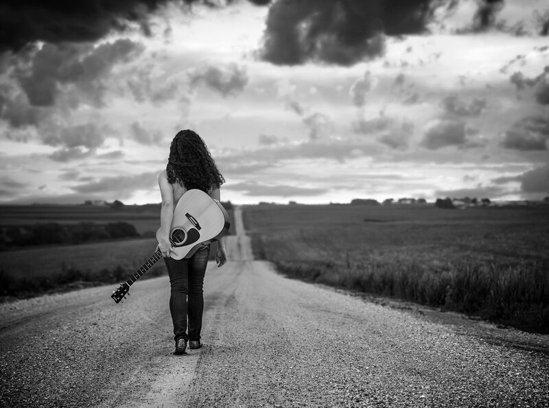 Woman with Guitar on Road — Black