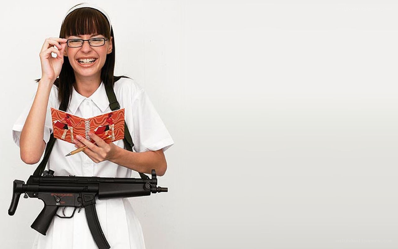 woman with gun and notebook