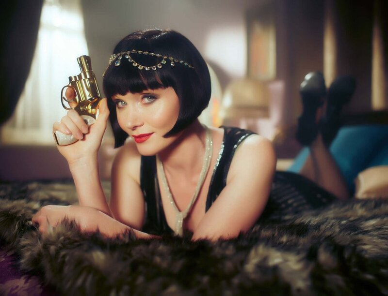 Woman with gun in 1920s style