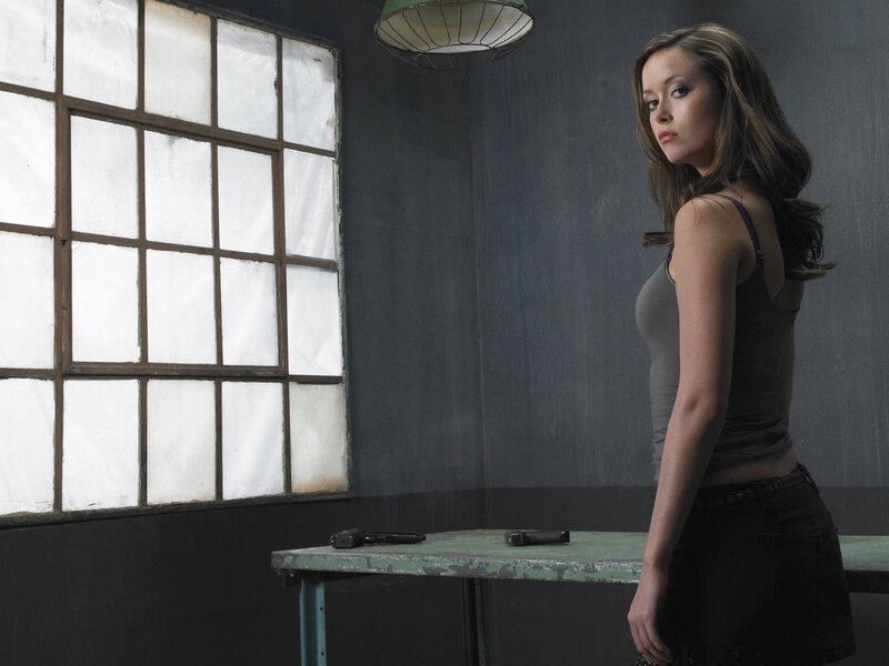 woman with guns in room