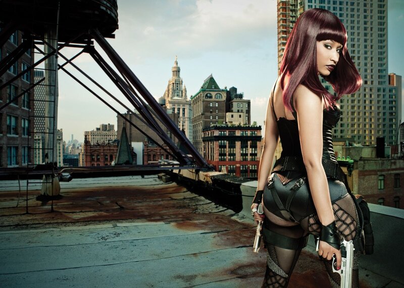 woman with guns on rooftop