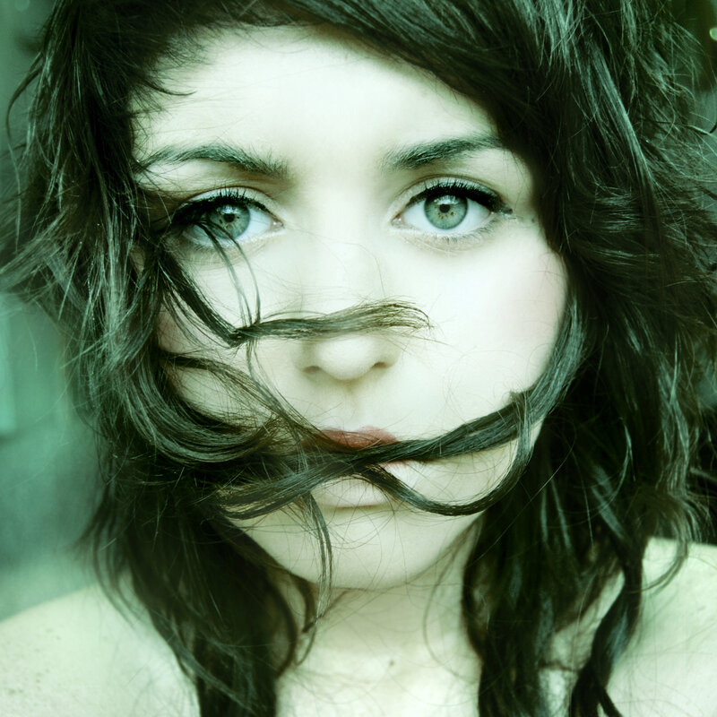woman with hair across face