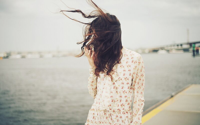 woman with hair blowing in wind