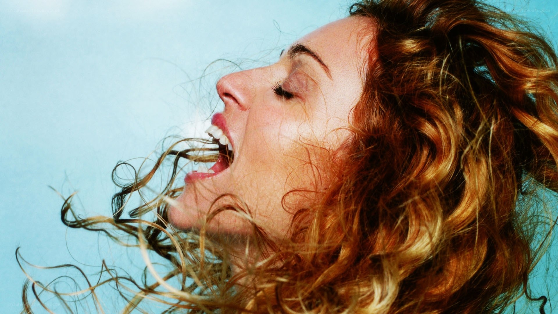 woman with hair blowing in wind