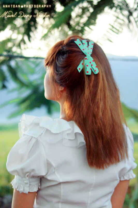 woman with hair clip from behind