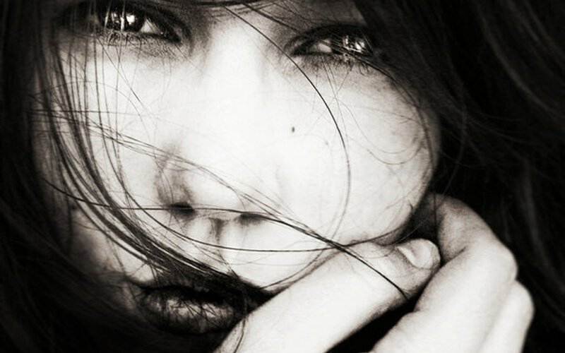 woman with hair covering face