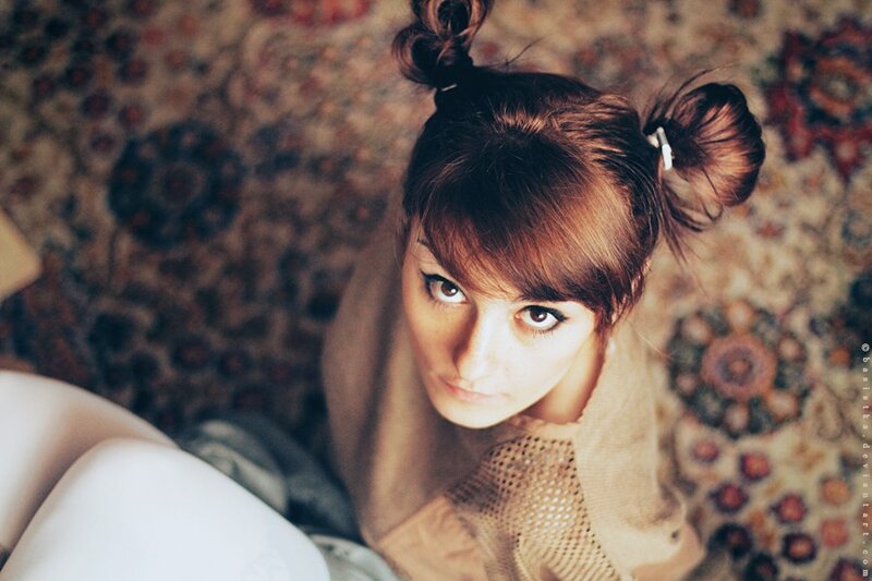 woman with hair in buns