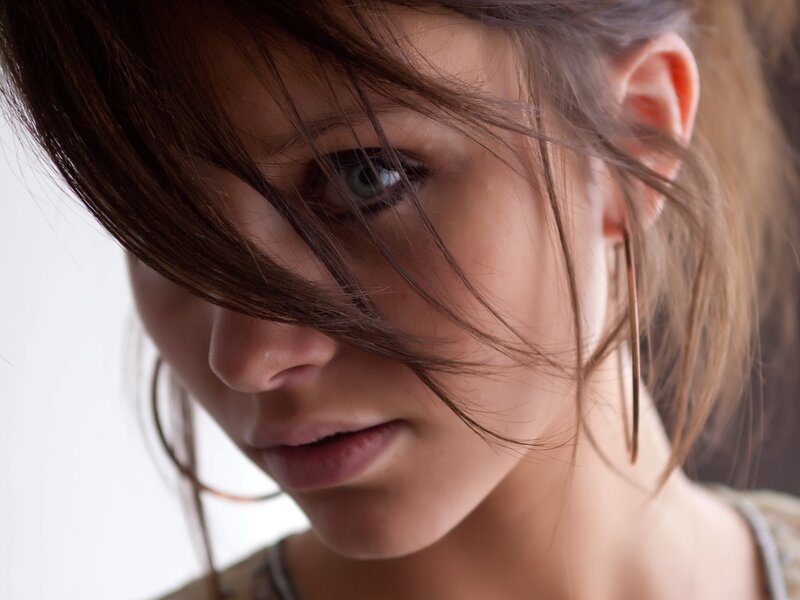 woman with hair in face
