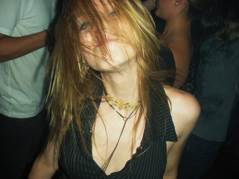 woman with hair in face at party