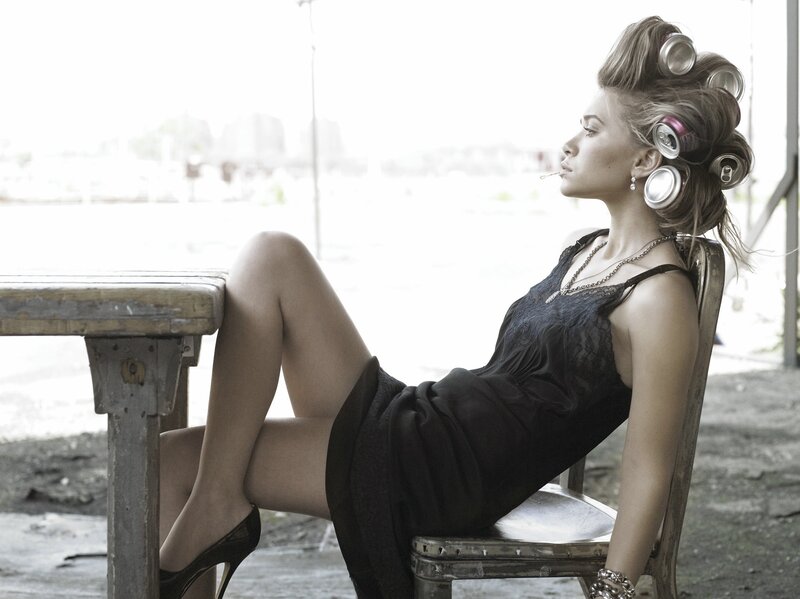 woman with hair rollers and cigarette