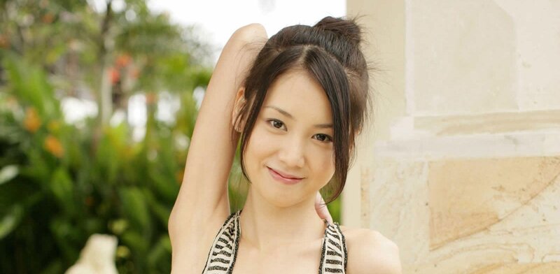 woman with hair up smiling