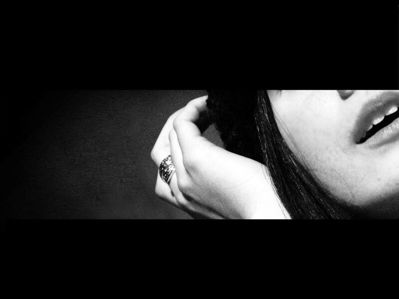 woman with hand near face