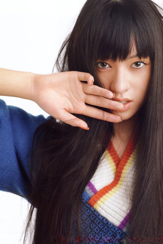 woman with hand near face