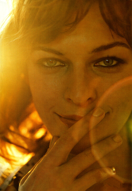 woman with hand near face