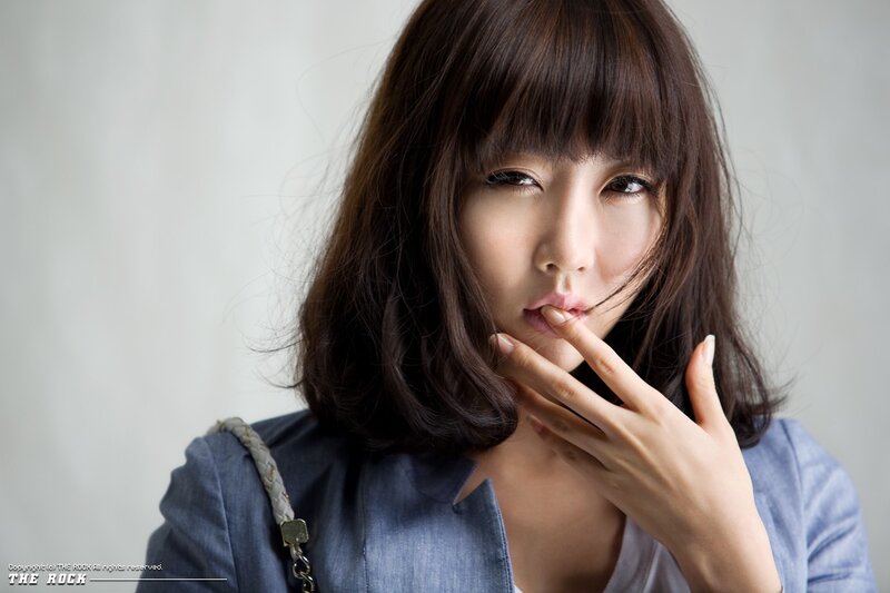 woman with hand near face