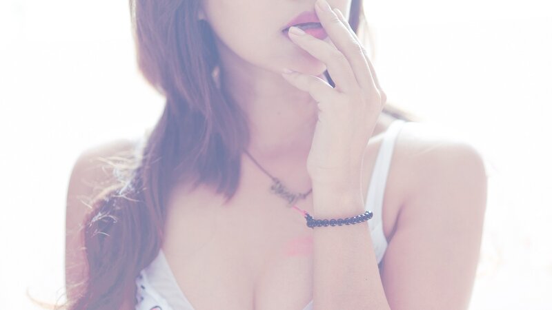 woman with hand near face