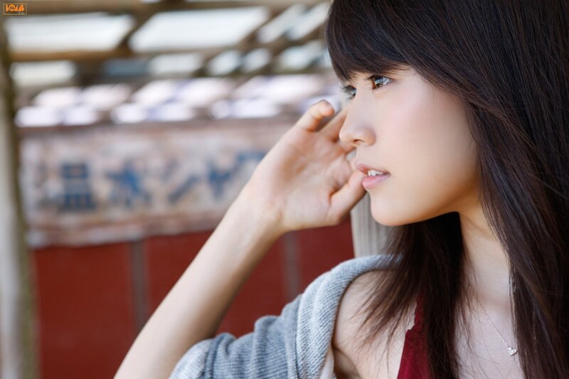 woman with hand near face