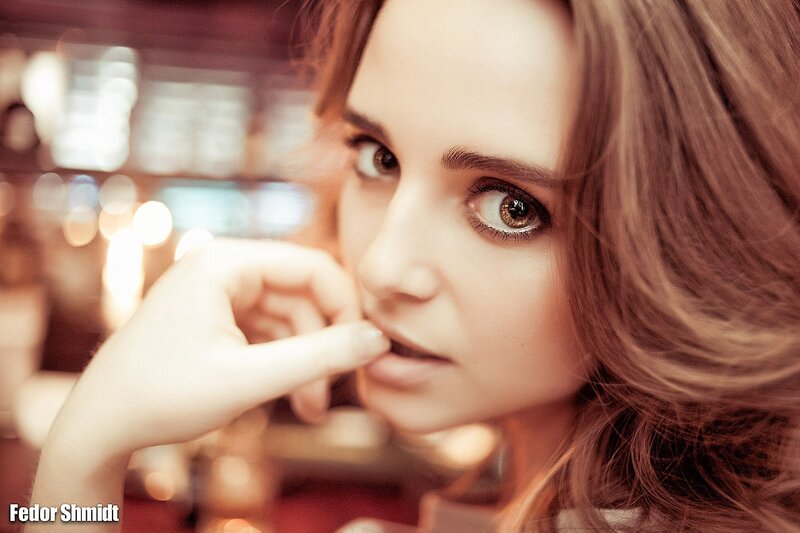 woman with hand near face