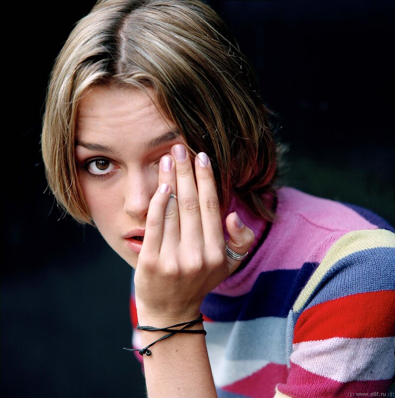 woman with hand near face