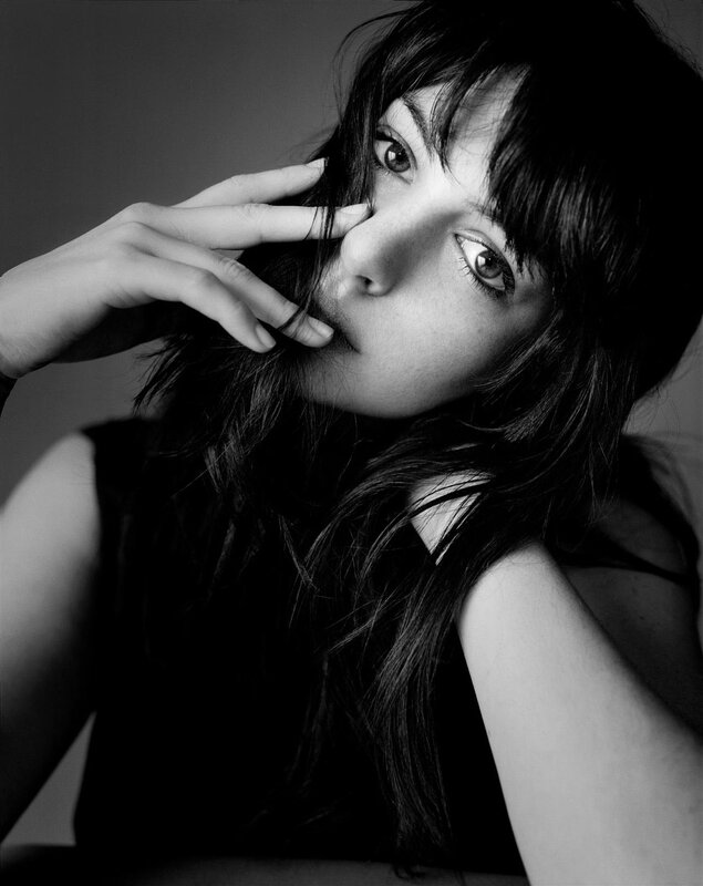 woman with hand near face