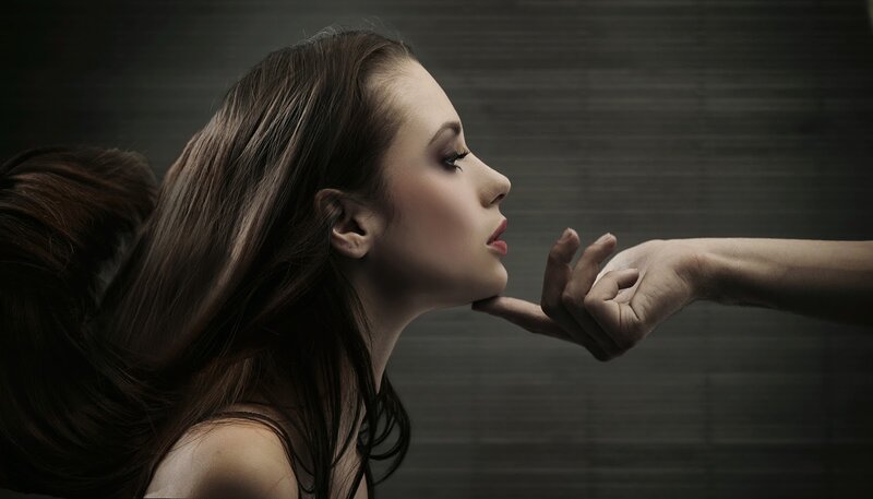 Woman with Hand Near Face — Brown