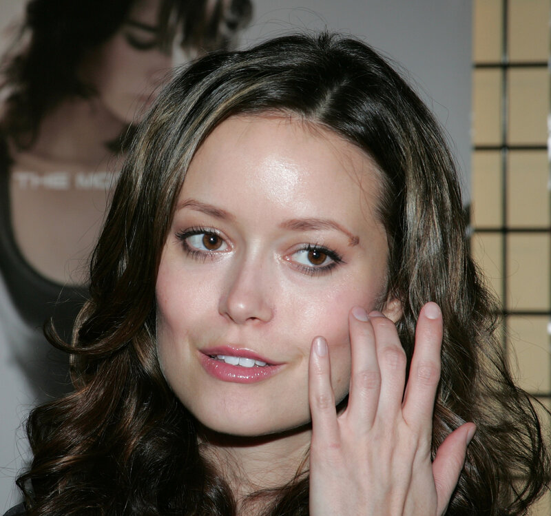 woman with hand on cheek