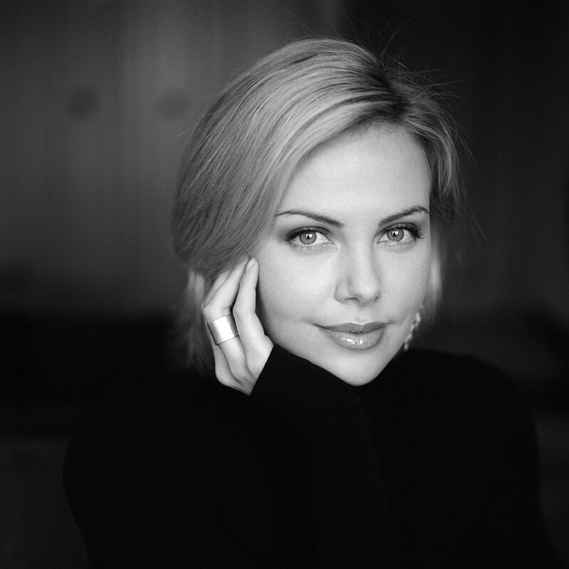 woman with hand on cheek