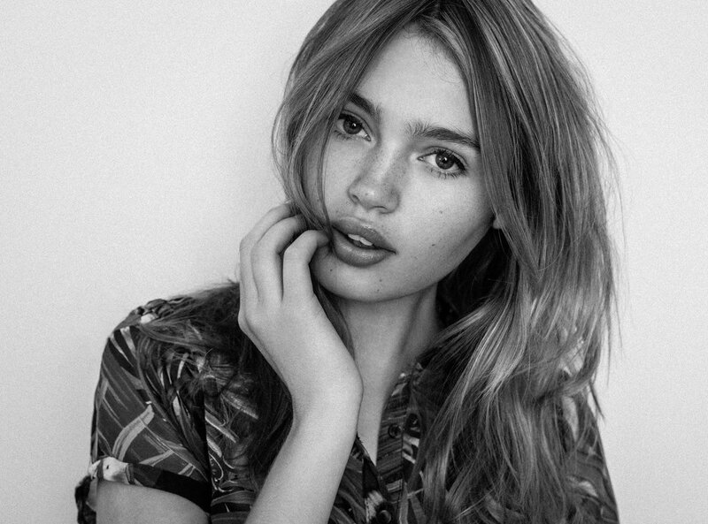woman with hand on cheek