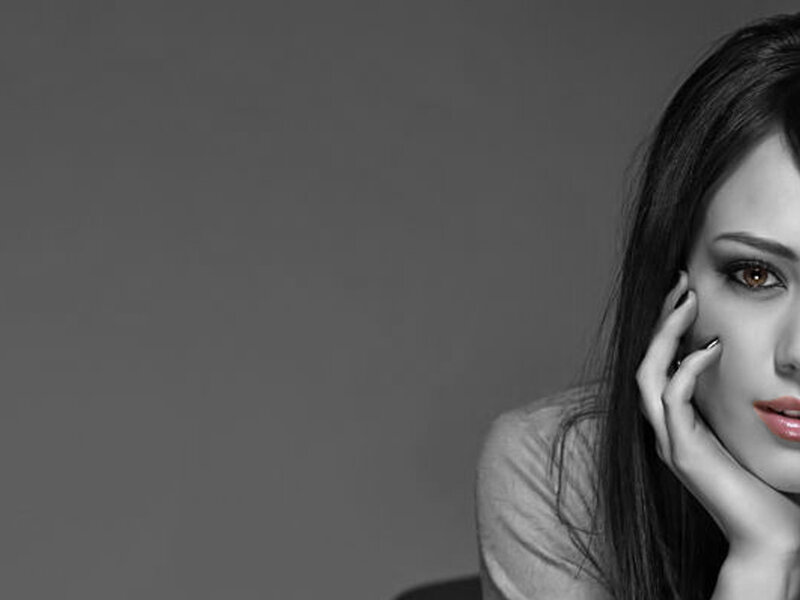woman with hand on cheek