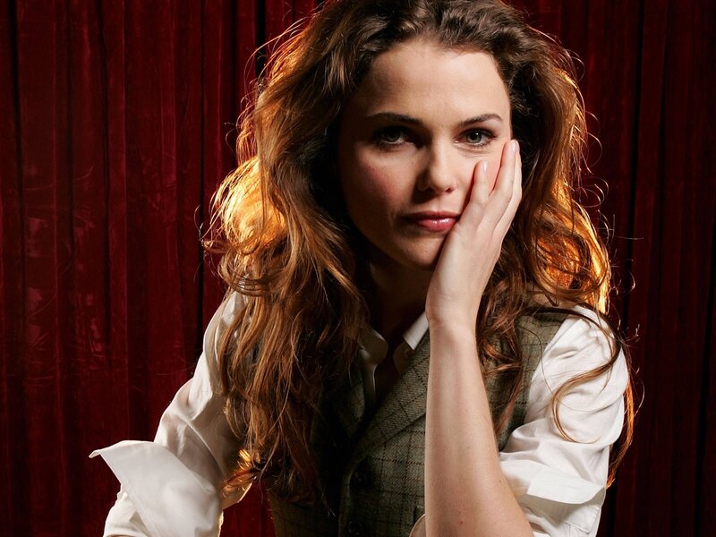 woman with hand on cheek