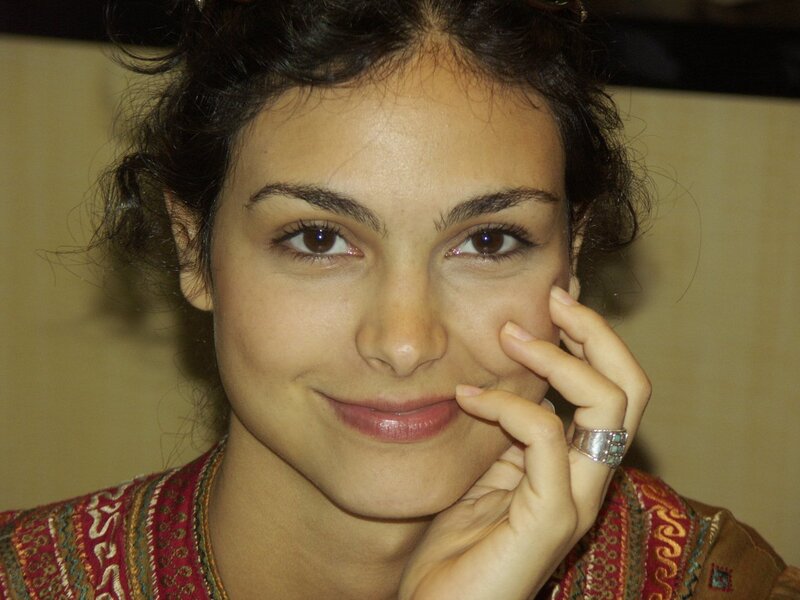 woman with hand on cheek