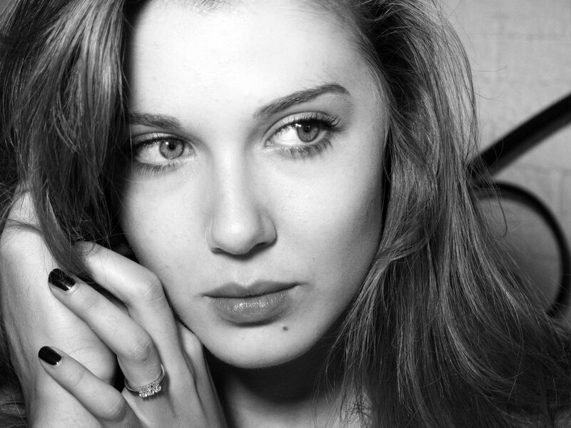 woman with hand on cheek