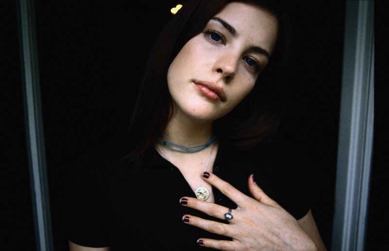 woman with hand on chest
