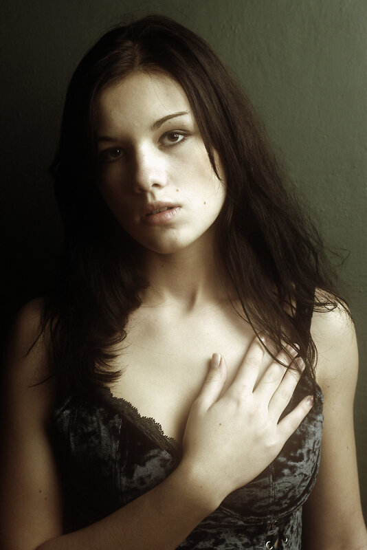 woman with hand on chest