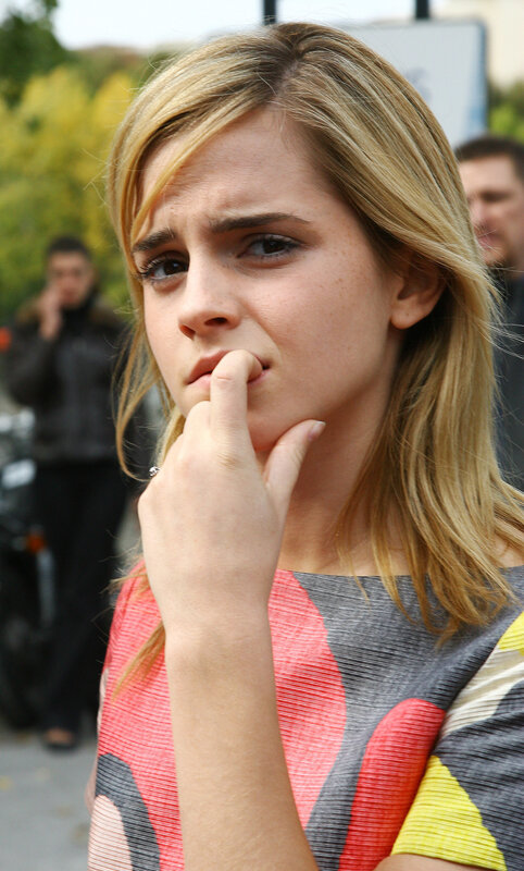woman with hand on chin