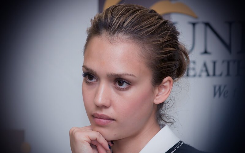 woman with hand on chin