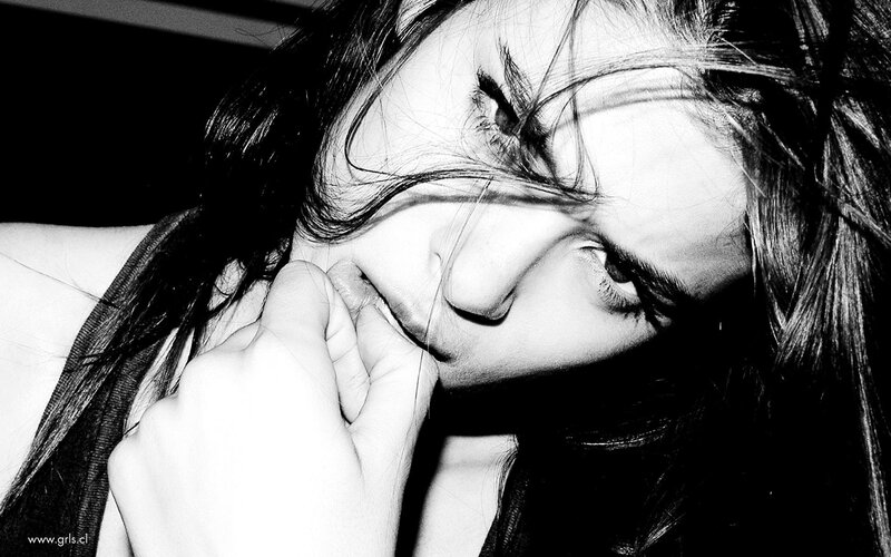 woman with hand on chin