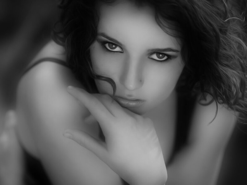 woman with hand on chin