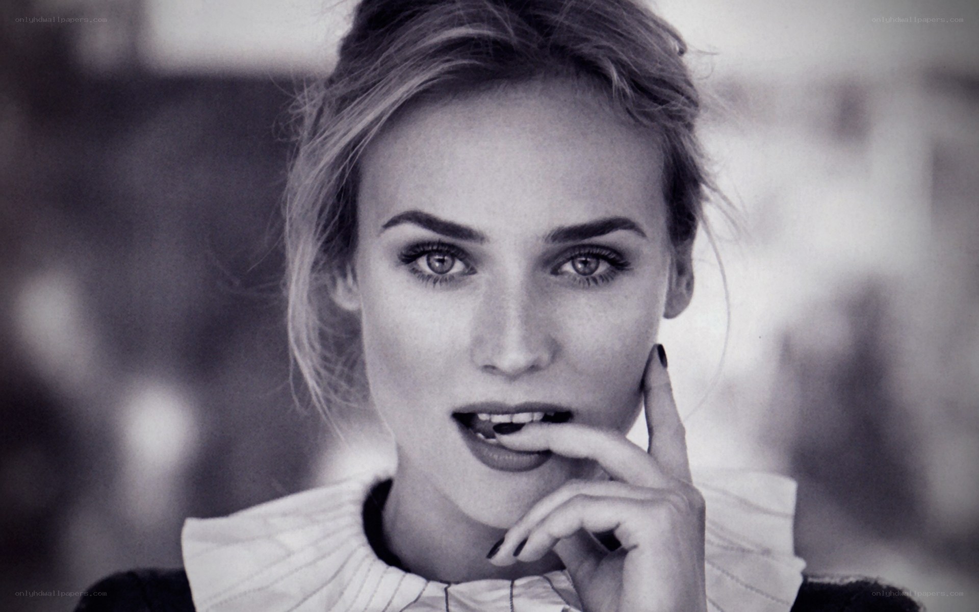 woman with hand on chin