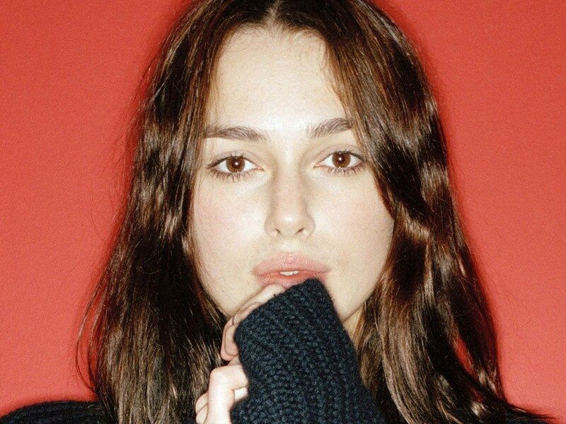 woman with hand on chin