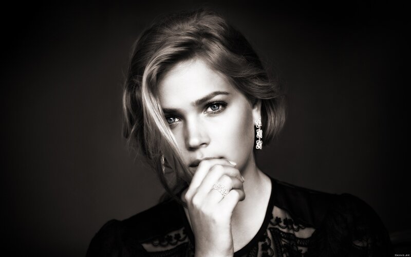 Woman with Hand on Chin — Black, Dramatic, Photograph, Earrings