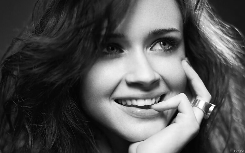 Woman with Hand on Chin — Black, Smiling