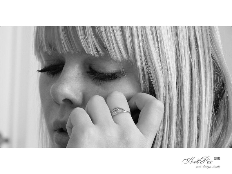 woman with hand on face