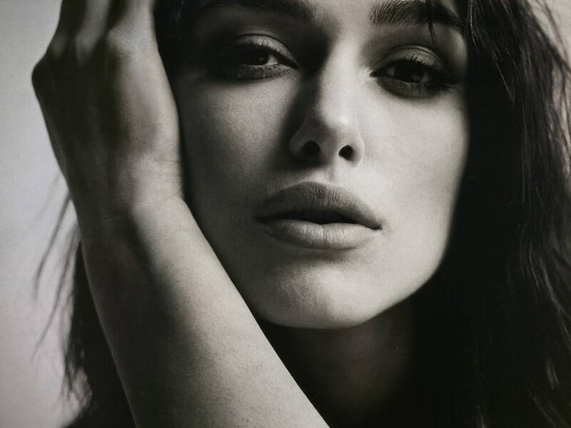 woman with hand on face