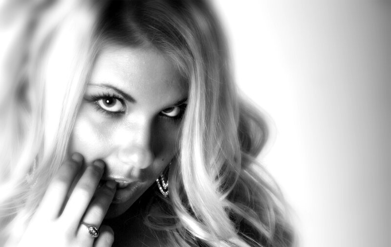 woman with hand on face
